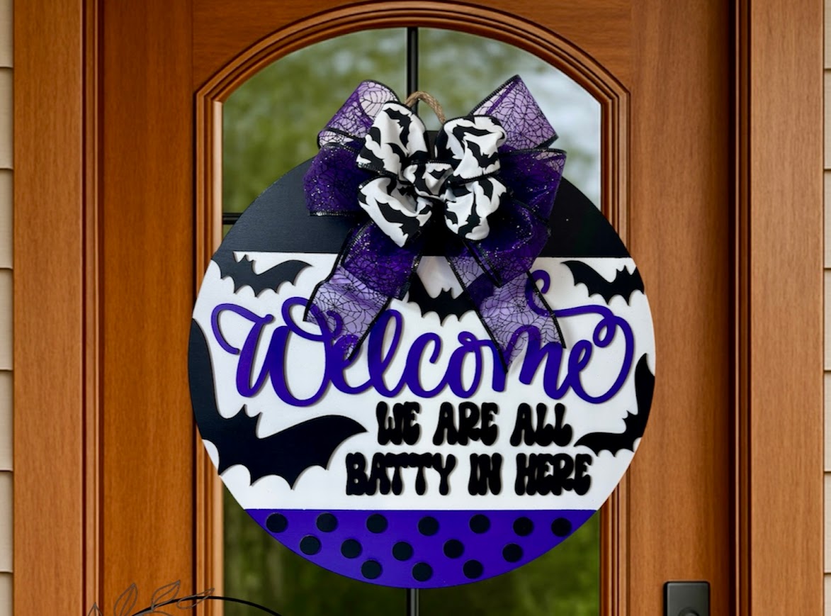 18" solid wood "We're All Batty Here" porch door hanger sign